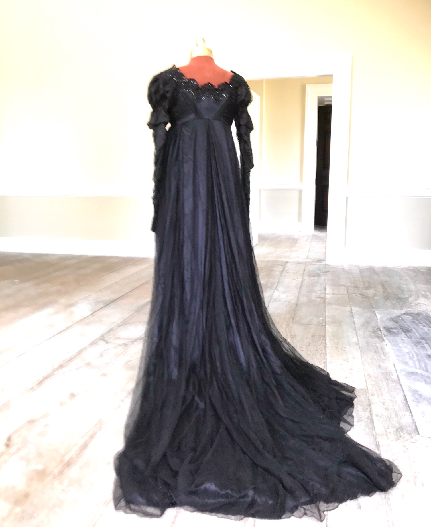 A fine quality lady's black satin, chiffon and jet trimmed Regency style evening dress with long train, lacing on jet stomacher. Ex English National Opera (unlabelled) 'Don Giovanni'